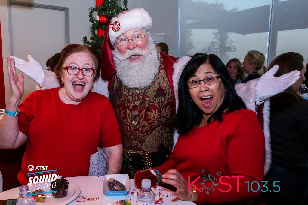 Santa with two staff ladies from KOST FM